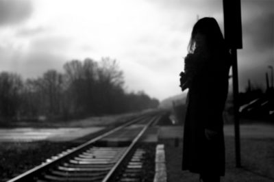 woman by tracks