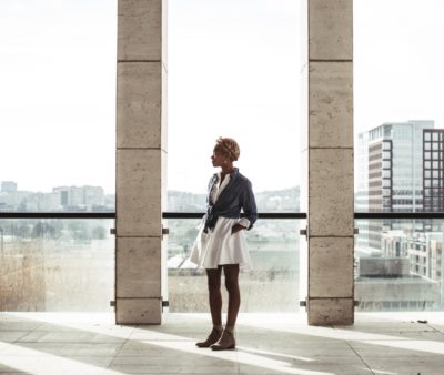 woman standing by the window