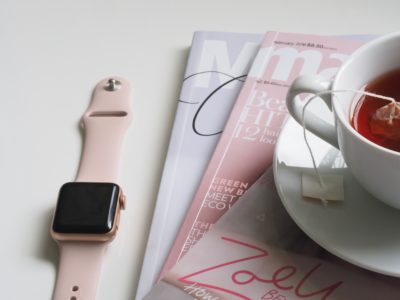 desk with watch and magazines