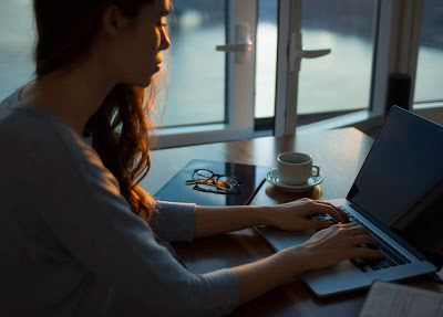 woman working on a laptop