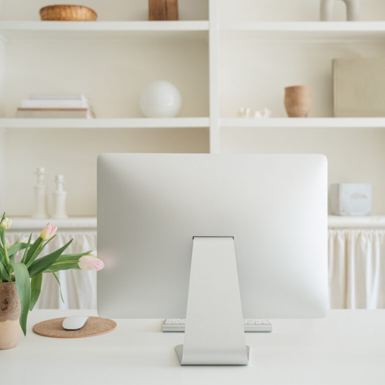 computer monitor in a soft off white decor
